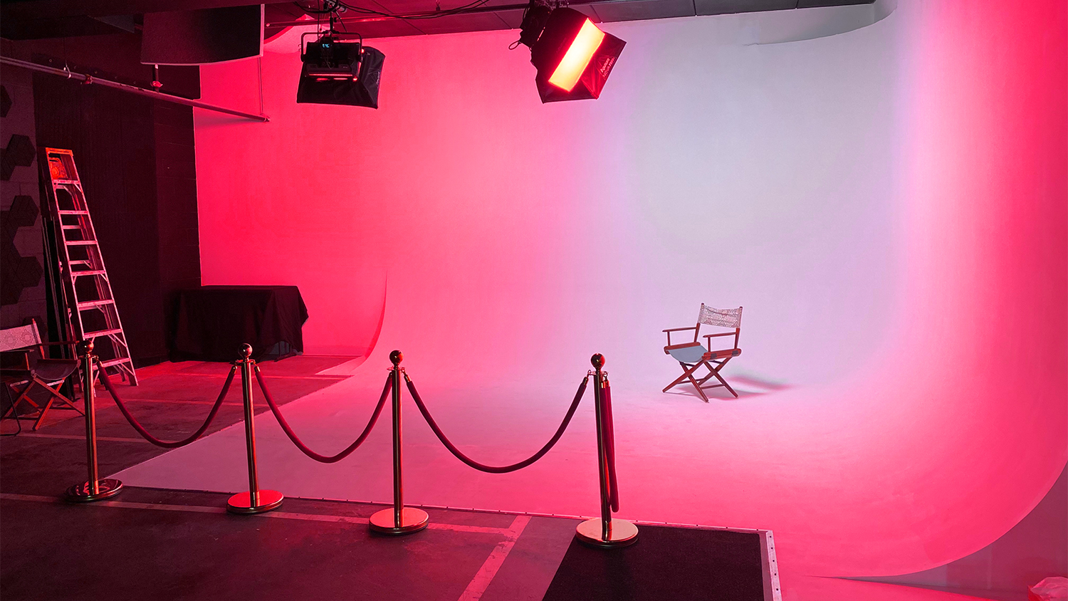 Cyc wall, cyclorama wall. or also known as infinity wall lights up in pink at Rockstoria Studios MN Minnesota Rental